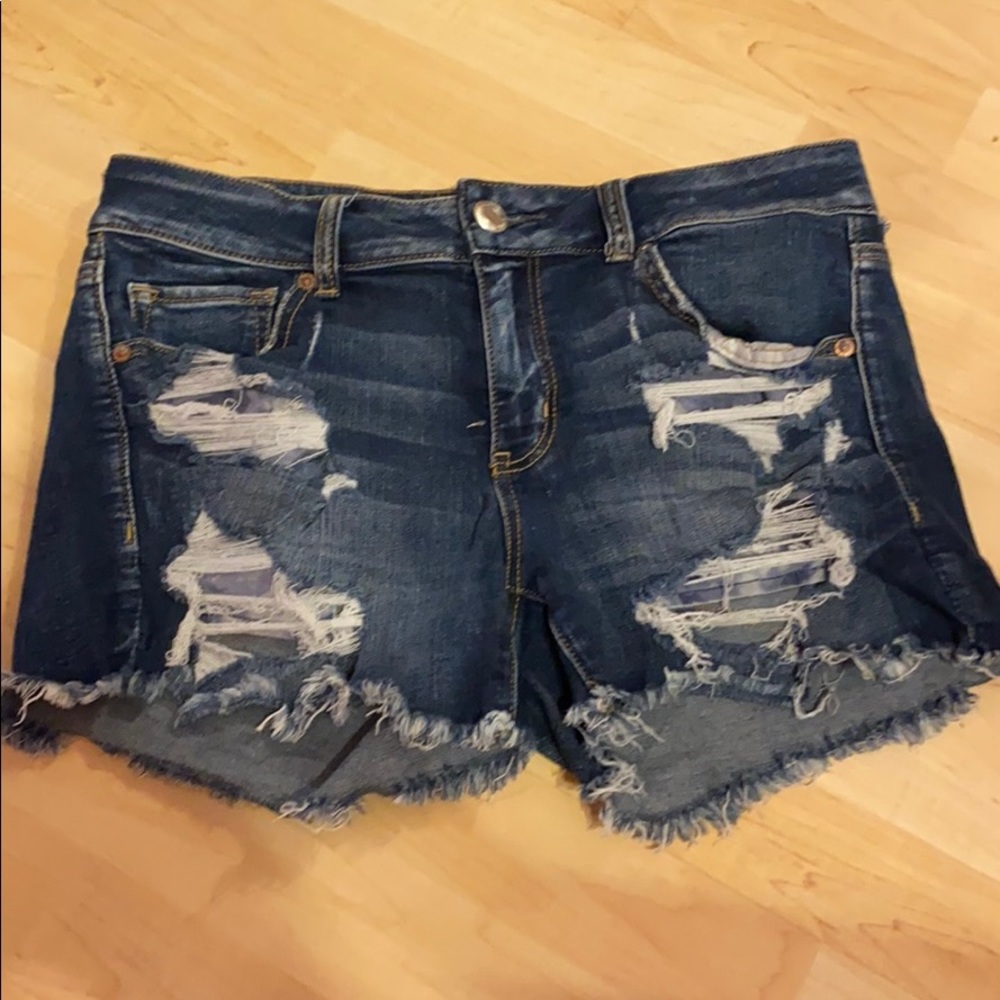 Distressed super stretch denim shorts